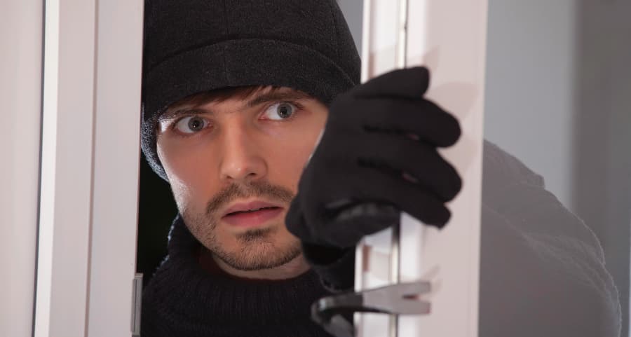 Burglar breaking into home